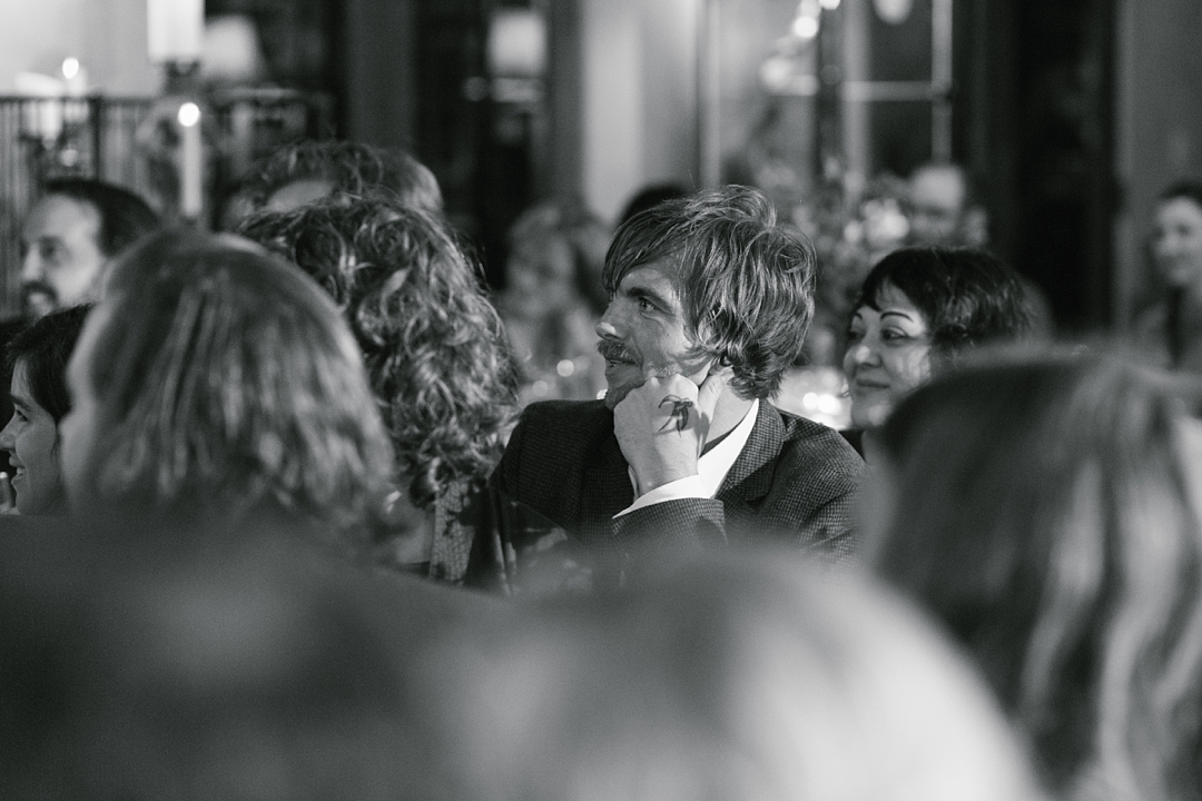 black and white of guest listening to speech