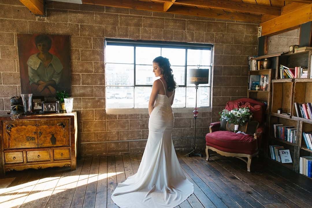 dramatic photo of bride by window at smoky hollow studios