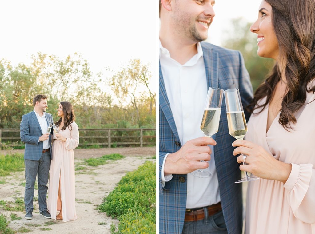 popping champagne during engagement session photos in playa vista