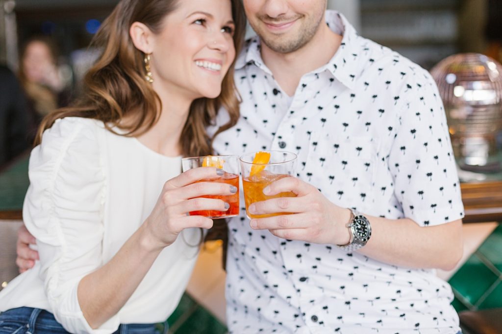couple enjoys happy hour at Conservatory WeHo during a WeHo engagement session
