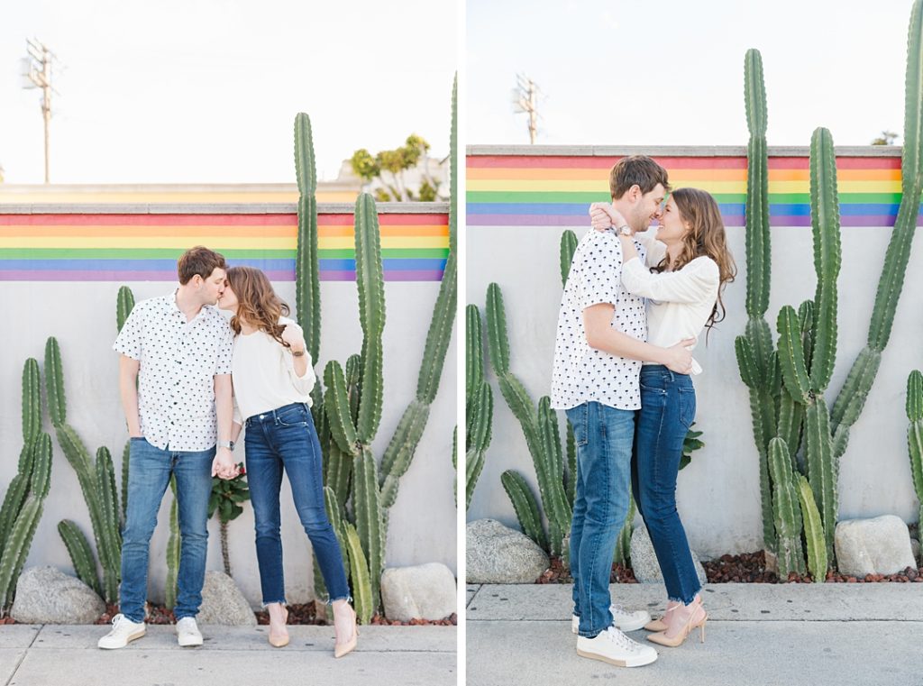fun West Hollywood engagement photos in front of cactus and rainbow wall
