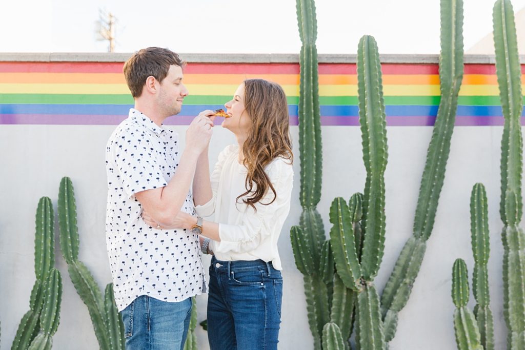 couple eats Jon & Vinny's pizza during West Hollywood engagement session