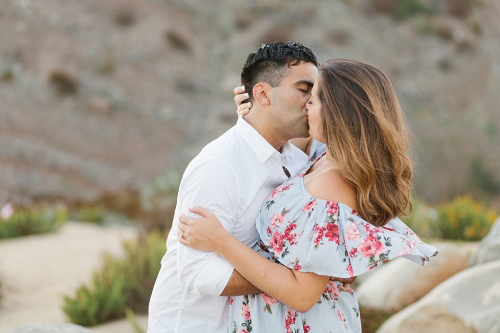 couple kisses on SoCal beach