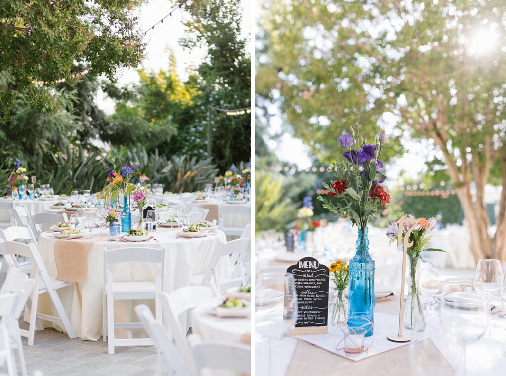 blue glass vases and chalkboard menus at summer wedding reception