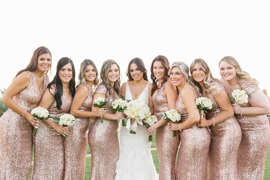 bridesmaids wear gold sequin dresses for California winter wedding