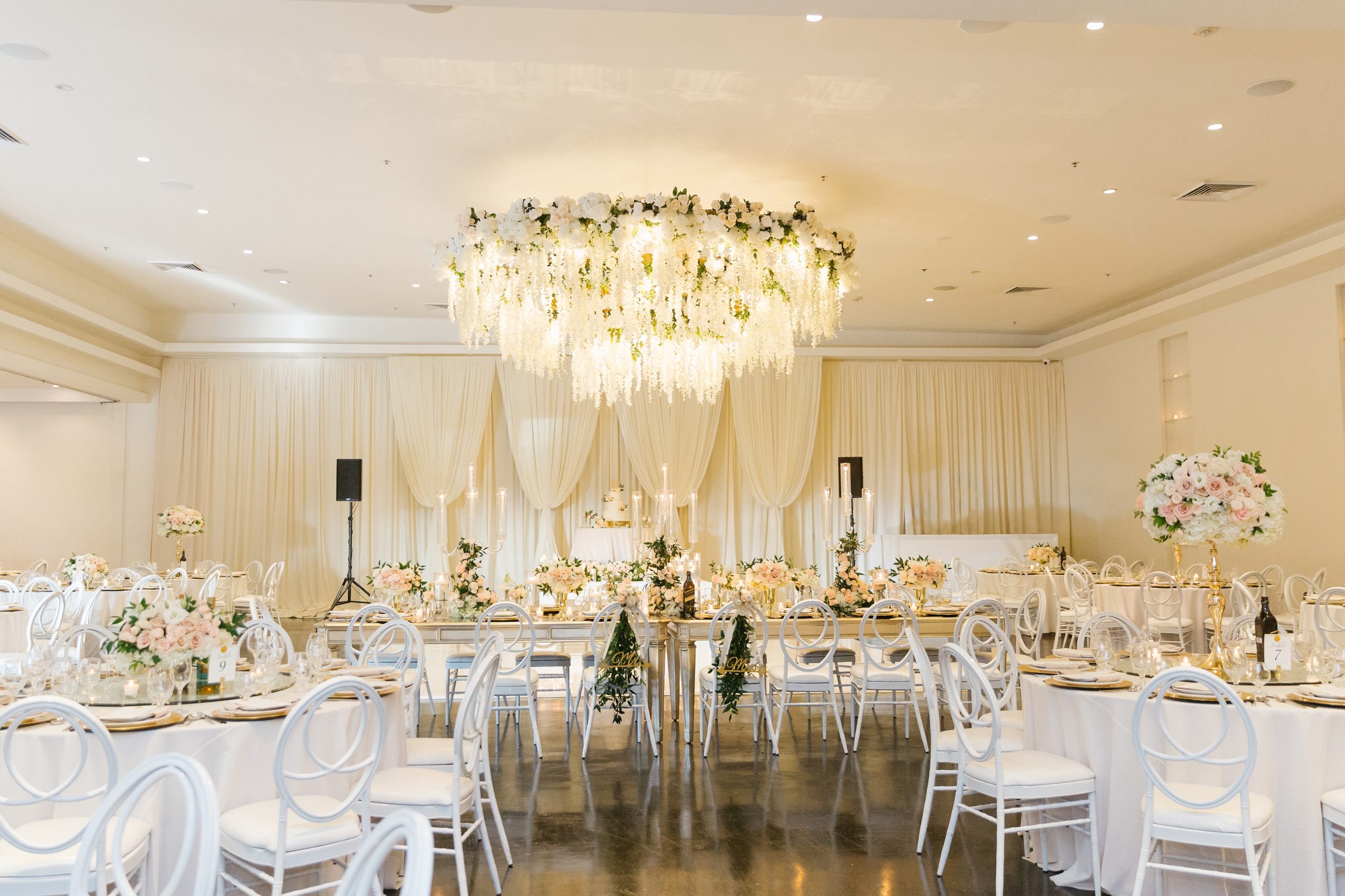 luxury wedding reception at The Venue in Huntington Beach with pink and white florals