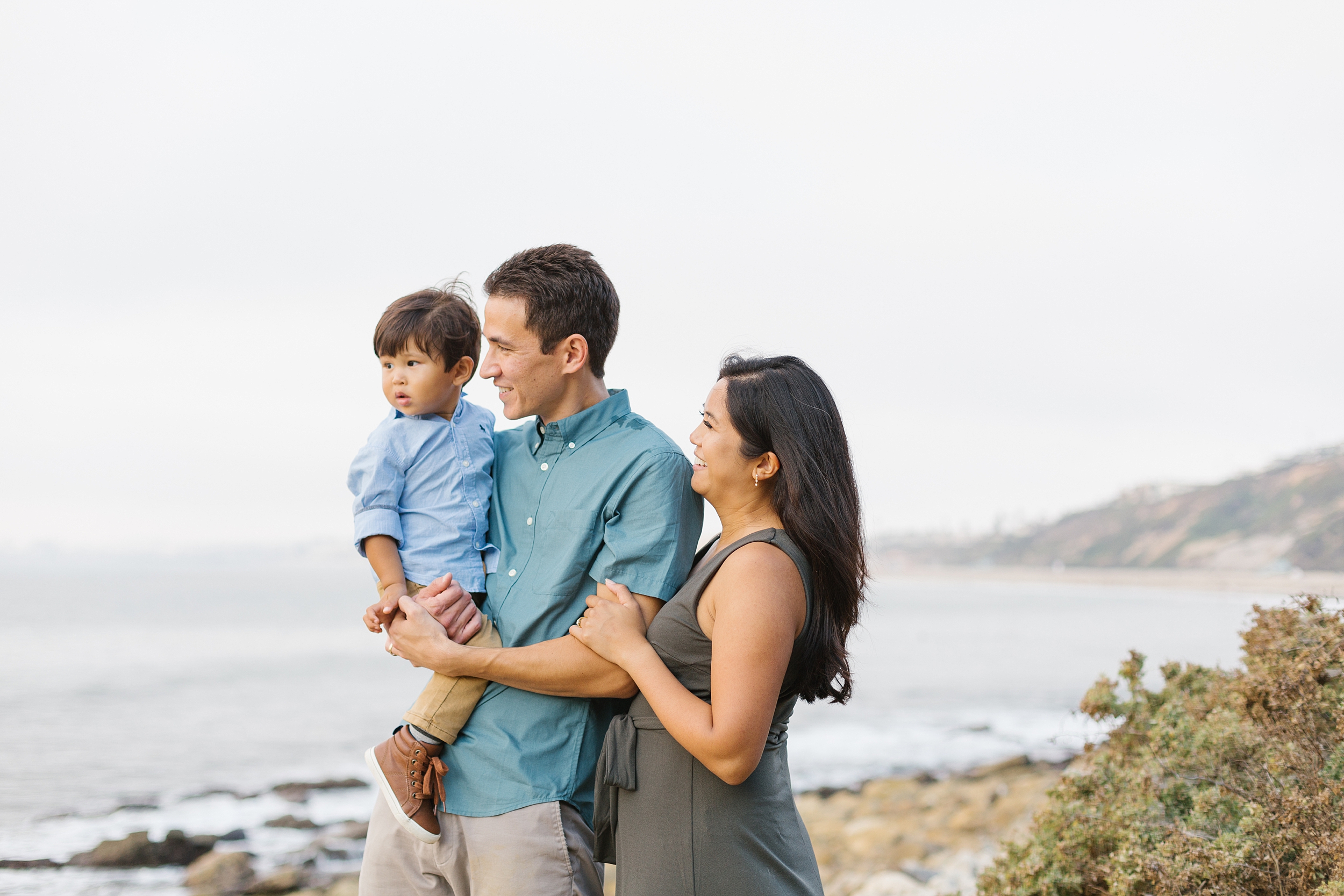 family enjoys ocean and cliff views at southern California family photo session