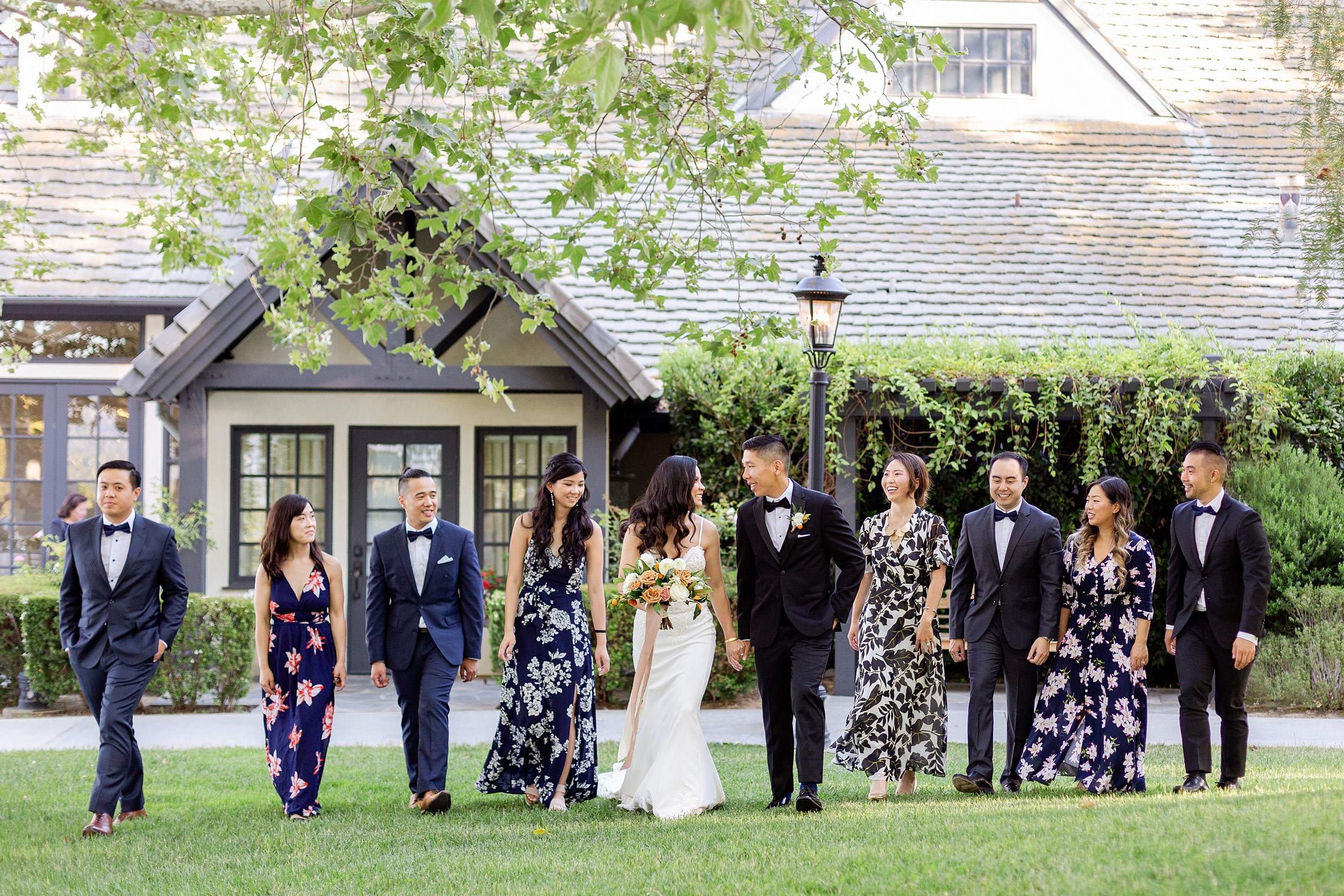 wedding party with floral bridesmaids dresses