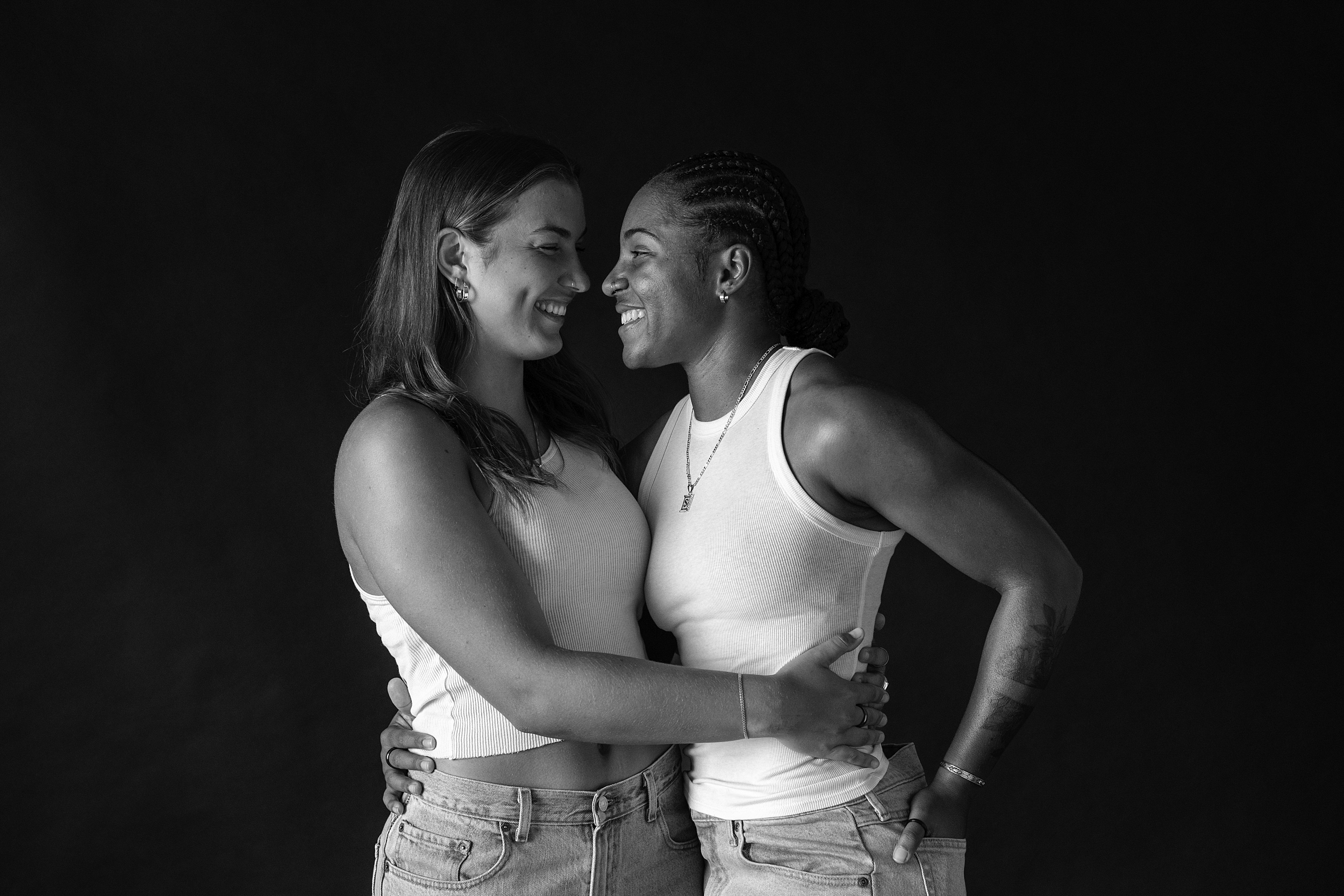 black and white studio portrait of same sex couple in los angeles studio