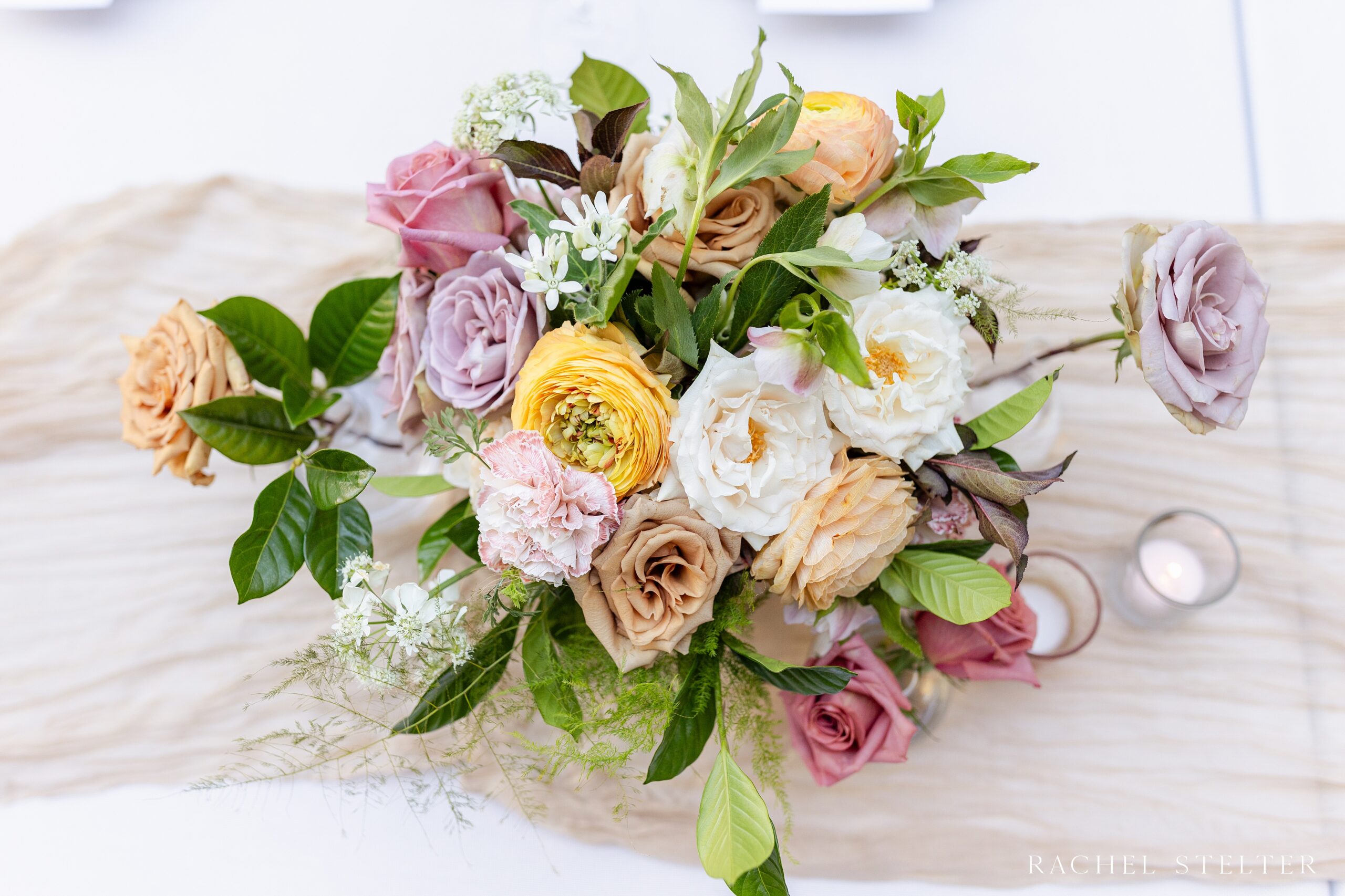 wedding centerpiece with muted blush flowers