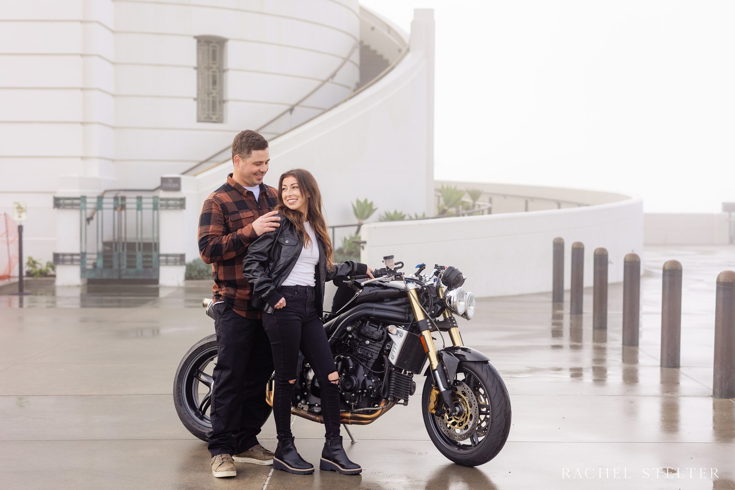 couple poses with motorcycle for engagement session in LA