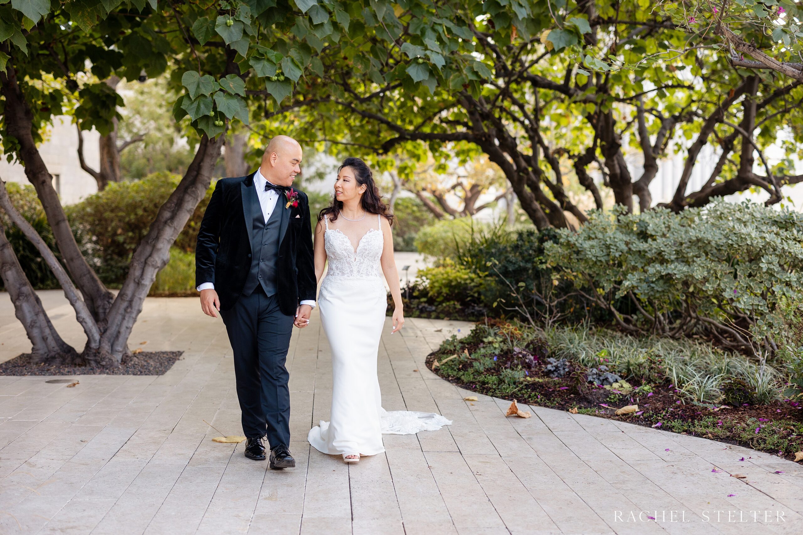 bride and groom stroll the Blue Ribbon Garden in LA
