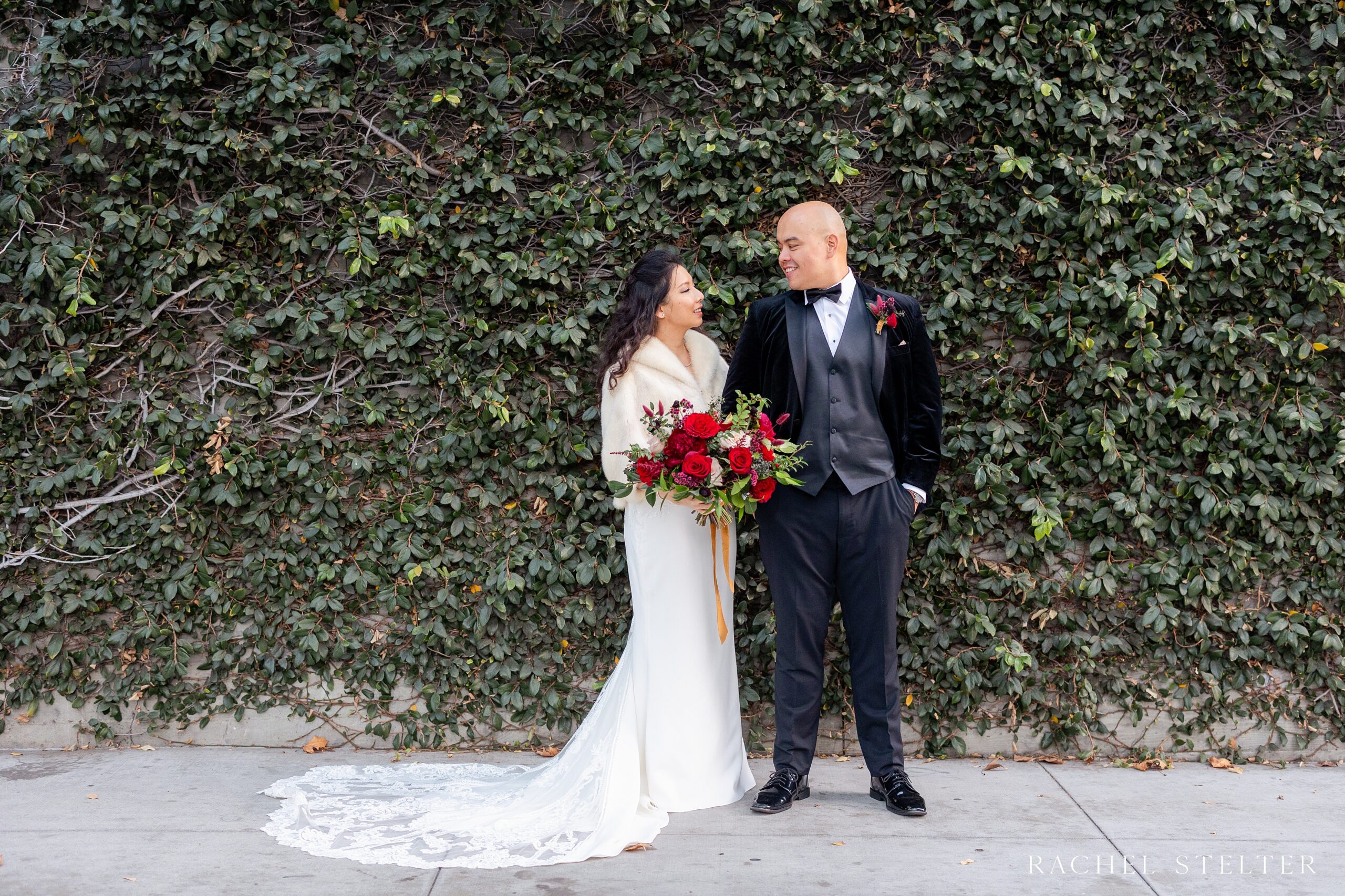 bride and groom in front of ivy covered wall for Los Angeles micro wedding 
